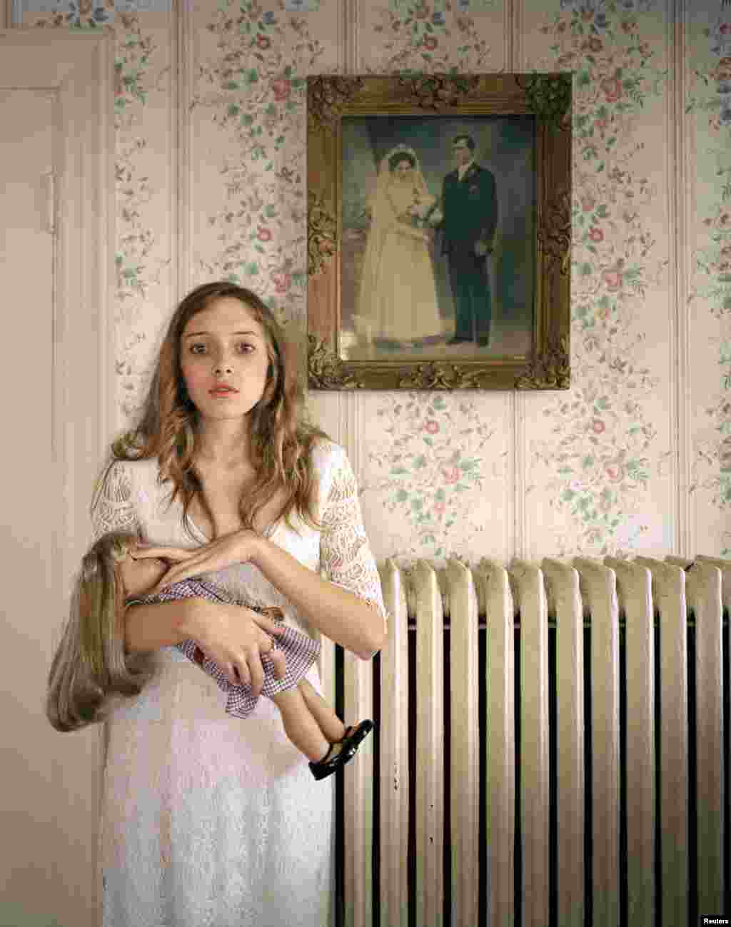 Ilona Szwarc of Poland, a photographer working for Redux Images, won third prize in the People -- Observed Portraits Single category with this picture of Kayla posing with her lookalike doll in front of a portrait of her ancestors in Boston, Massachusetts.