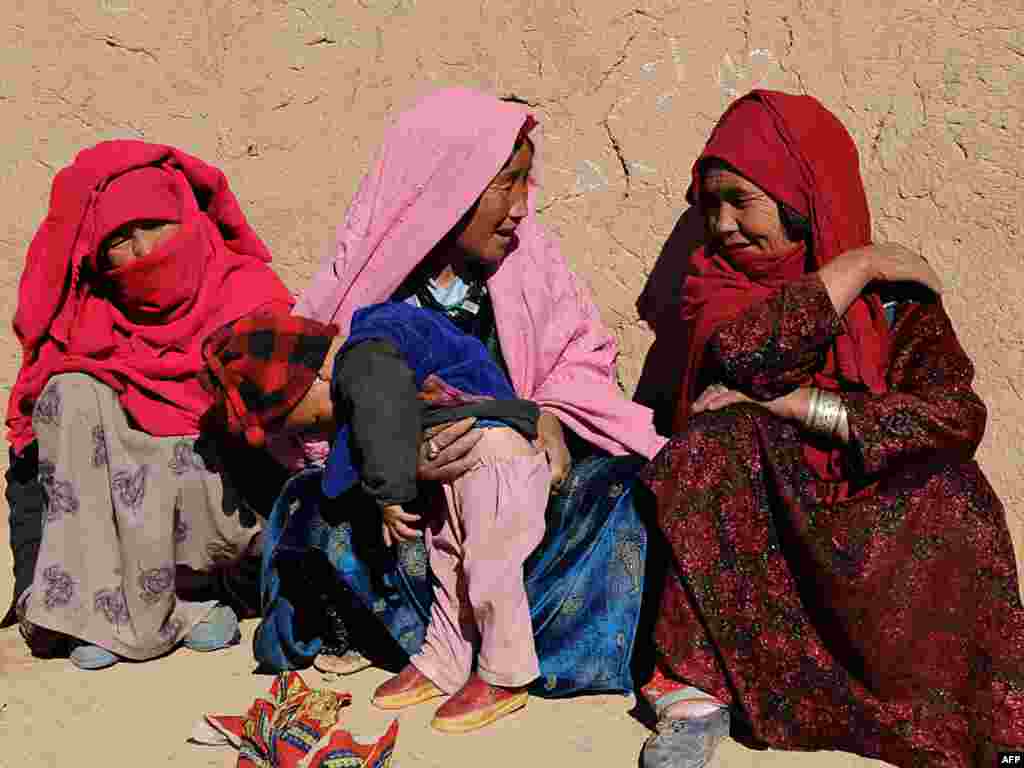 And in Bamiyan, Afghanistan, women chat in the sunshine. - Photos by AFP, epa, ISNA, and RFE/RL.