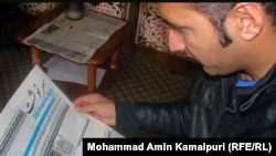 Afghanistan – An Afghan man read an Afghan newspaper for updating himself from a world situation on 10Jan2011