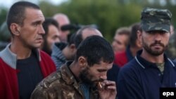 Украинские военные, вызволенные из плена по обмену с пророссийскими сепаратистами. Донецкая область, 20 сентября 2014 года.