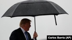 U.S. President Donald Trump boards Air Force One for a trip to Kansas City, Missouri, on July 24.