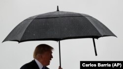 U.S. -- U.S. President Donald Trump boards Air Force One for a trip to Kansas City, Missouri from Joint Base Andrews in Maryland, U.S., July 24, 2018.