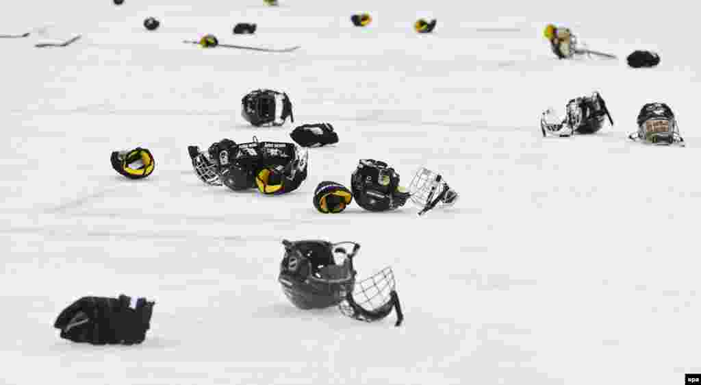 Swiss helmets on the ice after they won the women&#39;s bronze-medal match between Sweden and Switzerland. (epa/Larry W. Smith)