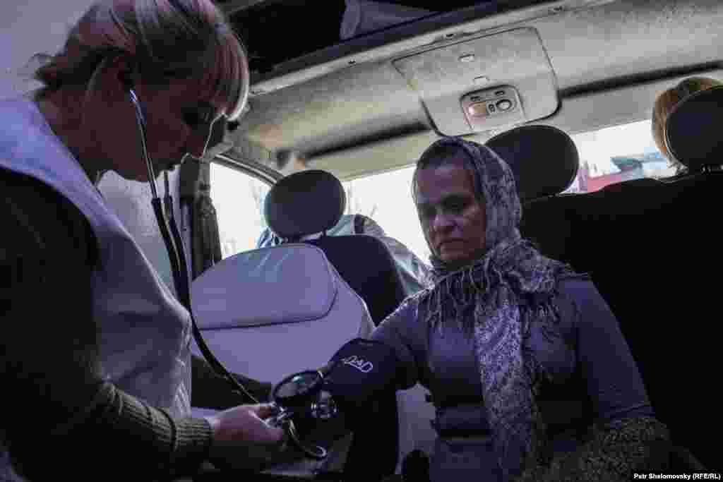 Volunteer medics deliver first aid.