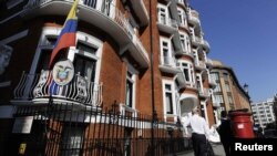 A man walks past Ecuador's embassy in London on June 20, one day after WikiLeaks' Julian Assange sought asylum there.