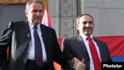 Armenia - Former President Levon Ter-Petrosian (L) and Nikol Pashinian greet supporters in Yerevan's Liberty Square, 31 May 2011.