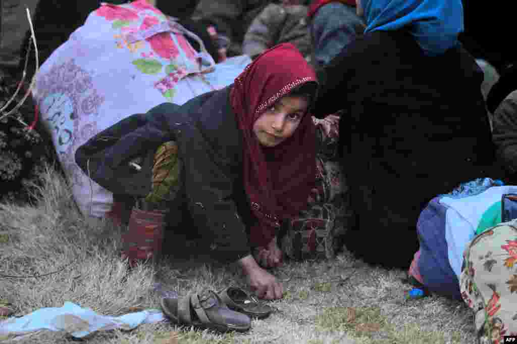 Iraqi families who fled the front line gather in the village of Al-Buseif, south of Mosul, during an offensive by Iraqi forces to retake the western side of the city from Islamic State fighters. (AFP/Ahmad al-Rubaye)