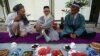 Muslim elders sit before a meal to celebrate a religious festival organised by the Islamic Renaissance Party in Dushanbe.