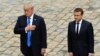 U.S. President Donald Trump (left) and French President Emmanuel Macron stand during the U.S. and French national anthems, during a welcome ceremony at Les Invalides in Paris on July 13.