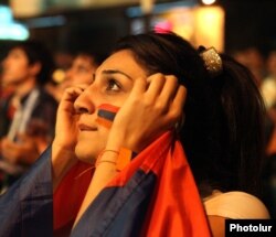 Armenia - A football fan in Yerevan watches Ireland-Armenia soccer game in Dublin, 11Oct2011.