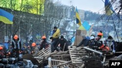 Battling over a barricade on Independence Square early on December 11.