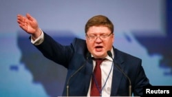 Andrei Isayev delivers a speech at a French National Front congress in Lyon in 2014.