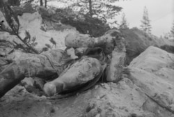 The frozen corpse of a Soviet soldier lies where he died.