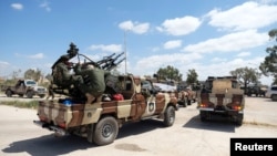 Libyan National Army fighters, commanded by Khalifa Haftar, head out of Benghazi to reinforce the troops on April 7, 2019. 