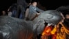 A statue of Soviet state founder Vladimir Lenin is toppled by protesters during a rally organized by pro-Ukraine supporters in the center of the eastern city of Kharkiv on September 28.