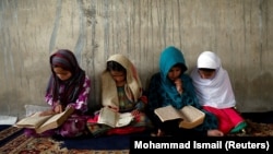 Afghan girls read the Koran at a madrasah in Kabul during Ramadan. (file photo)