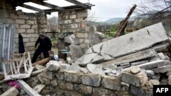 Nagorno-Karabakh -- A man walks through the ruins of his house in the village of Talish, some 80km north of Karabakh's capital Stepanakert, April 6, 2016