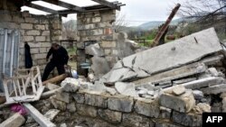 Nagorno-Karabakh -- A man walks through the ruins of his house in the village of Talish, some 80km north of Karabakh's capital Stepanakert, April 6, 2016