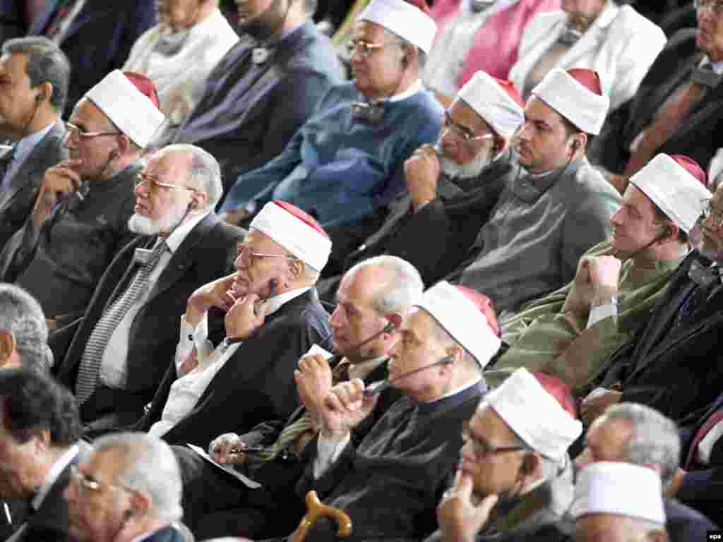 Caption: epa01750771 Audience members listen to a translation through headphones as US President Barack Obama speaks on American foreign policy at Cairo University in Cairo, Egypt on 04 June 2009. The much anticipated address was aimed at challenging Muslim perceptions about the US