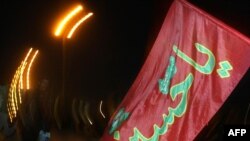 Pilgrims walk towards the holy southern city of Karbala to mark the 40th day after Ashura on February 12.