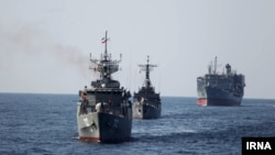 Iranian warships conduct military exercises during Velayat-90 naval maneuver on January 2012 . UNDATED