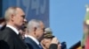 Russian President and the Supreme Commander-in-Chief of the Russian Armed Forces Vladimir Putin (L) and Israeli Prime Minister Benjamin Netanyahu (2-L) attend the Victory Day military parade in the Red Square in Moscow, 09 May 2018.