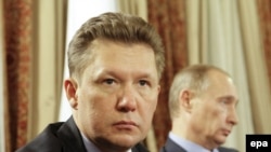 Gazprom chief Aleksei Miller (left) with Prime Minister Vladimir Putin at a 2009 meeting