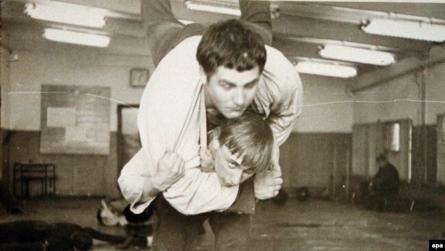 A young Vladimir Putin in a judo training fight at
              a St. Petersburg sports school in 1971.