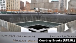 The old Twin Towers are memorialized by two gaping square holes where the footprints of the buildings were. Each have waterfalls cascading down the sides, which then drain into a seemingly bottomless hole. The surrounding walls are engraved with the names of the nearly 3,000 people who died in the 9/11 attacks.