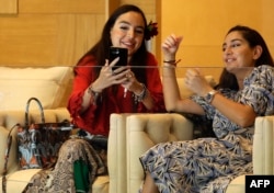 Leyla (left) and Arzu Aliyeva attend the taekwondo finals at the Baku 2017 4th Islamic Solidarity Games at the Baku Sports Hall in Baku in May 2017.