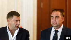 Aleksandr Zakharchenko (left) and Igor Plotnitsky in Minsk in September (file photo)