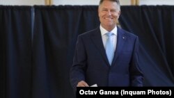 Romanian President Klaus Iohannis casts his vote in a May 26 referendum on changes to the country's judiciary and anti-corruption legislation. 