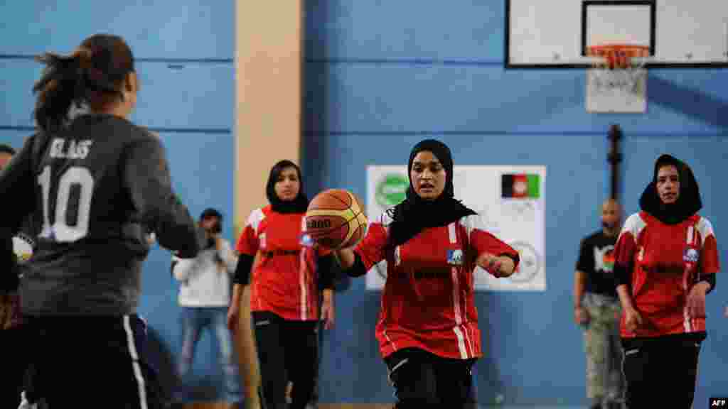 Afghanistan&#39;s women&#39;s Olympic basketball team plays a game with personnel from ISAF and the U.S. Embassy to mark International Women&rsquo;s Day in Kabul in March.