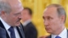 Russian President Vladimir Putin (right) and Belarusian President Alyaksandr Lukashenka. Few analysts expect the Kremlin to sanction a military intervention of the kind seen in Ukraine in 2014. (file photo)
