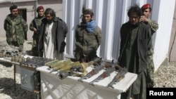 Afghan authorities present captured Taliban insurgents in Ghazni province last March. Now, local villagers from the same area have formed their own militia to take on the militants by themselves. 