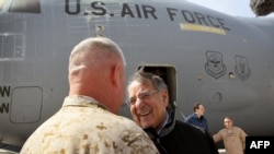 Afghanistan -- United States Secretary of Defense Leon Panetta is greeted after arriving at Camp Bastion, 14Mar2012