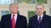 U.S. President Donald Trump greets Turkey's President Recep Tayyip Erdogan (L) upon arrival outside the White House in Washington, DC on November 13, 2019. 