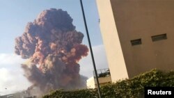 Smoke rises after an explosion in Beirut, Lebanon August 4, 2020, in this picture obtained from a social media video. 