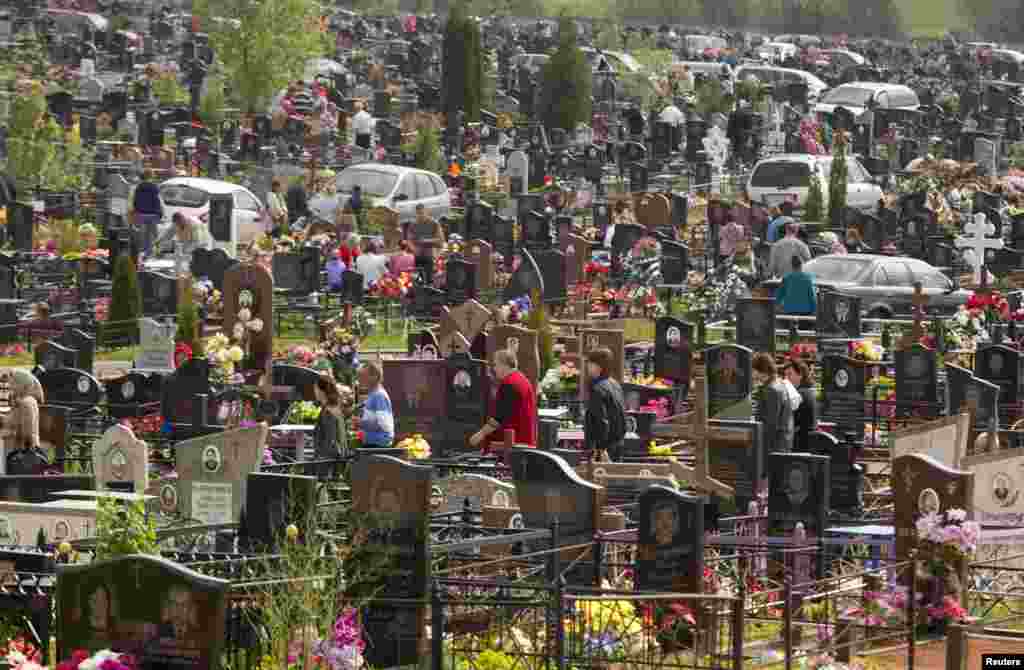 People gather on Radunitsa, or the Day of Rejoicing, at a cemetery on the outskirts of Minsk. The Orthodox Church holiday remembers the dead. (Reuters/Vasily Fedosenko)