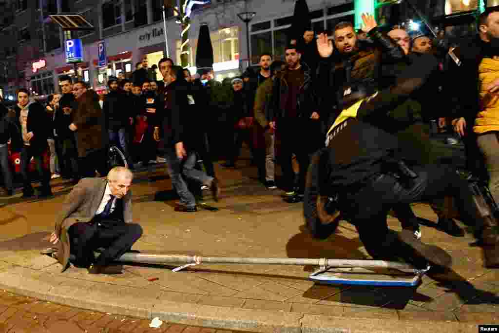 Demonstrators clash with riot police during running battles in the streets near the Turkish Consulate in Rotterdam, the Netherlands. Dutch authorities expelled Turkish Family Affairs Minister Fatma Betul Sayan Kaya and prevented Turkish Foreign Minister Mevlut Cavusoglu from landing in the country. The two ministers had planned to address rallies on March 12 in support of a Turkish referendum planned next month that would give President Recep Tayyip Erdogan increased presidential powers. (Reuters/Dylan Martinez)