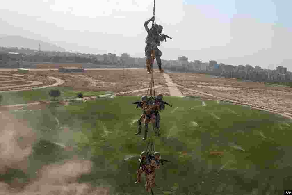 Iranian members of the Basij militia take part in training during a two-day exercise show in Tehran on September 3. (AFP/Tasnim/Hossein Zohrevand)