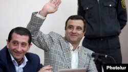 Armenia - Former presidential candidate Vartan Sedrakian waves to relatives during his trial in Yerevan, 20May2013.