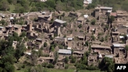 FILE: A photograph taken from a Pakistani army helicopter shows empty houses whose roofs have been removed by the army during a military operation are seen in the South Waziristan tribal district.