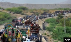 Civilians flee the fighting in North Waziristan in 2014.