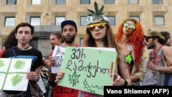 Activists gather during a rally in support of marijuana legalization in central Tbilisi.