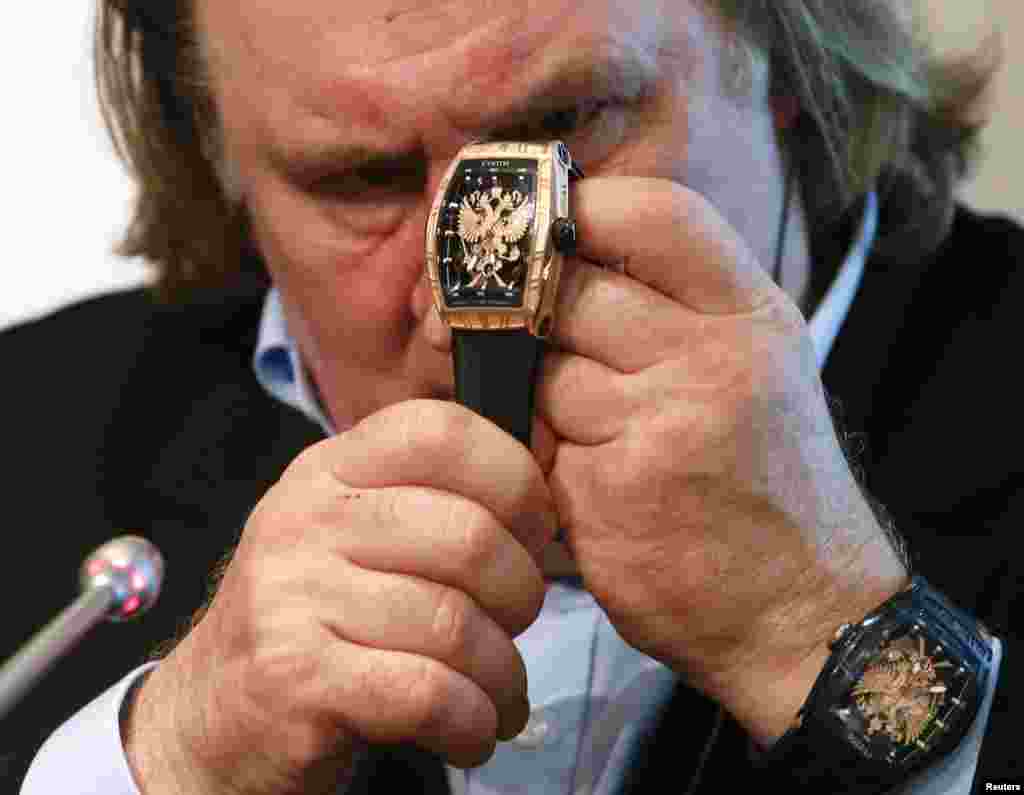 French-born actor Gerard Depardieu attends a ceremony and news conference to present the luxury watch from the line &quot;Proud to be Russian&quot; in Moscow on December 17. (Reuters/Maxim Zmeyev)