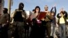 Pro-Russian protesters take part in a rally near the seized office of Ukraine's state security service in Luhansk late last month. 