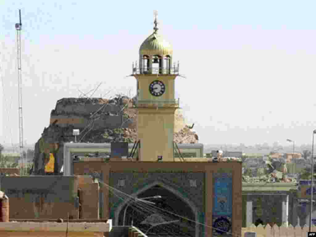 The damaged mosque on June 13 (Fars) - Following al-Mutawakkil's death in 861, his successor had Imam Ali poisoned in 868. Hasan died in 874.