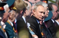 Russia's President Vladimir Putin attends the Victory Day parade in Red Square on June 24.