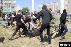 Police detain far-right activists who attacked a gay-pride in Kyiv in June 2015.